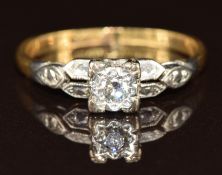 An 18ct gold ring set with a diamond of approximately 0.1ct in a platinum setting, 2.3g, size N