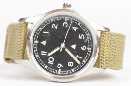 British RAF military style wristwatch with luminous hands and hour markers, white Arabic numerals,