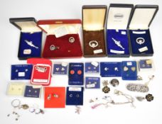 Thirteen pairs of silver earrings including mushrooms, hearts, horseshoe, shamrocks, etc, four