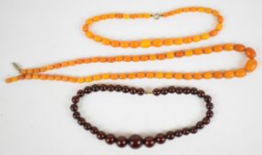 Two strands of graduated Baltic amber beaded necklaces (49g) and a strand of graduated cherry