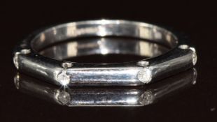 An 18ct white gold ring set with four diamonds, 3.1g, size K