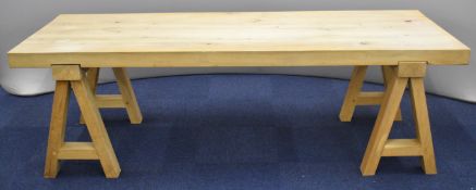 Contemporary substantial solid oak dining or boardroom table raised on two free standing trestles,