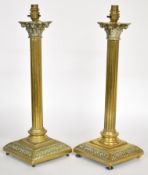 Pair of brass Corinthian column table lamps, height 52cm