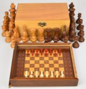 Two chess sets comprising Staunton Chessmen boxwood set with 10cm King and an unnamed early 20th