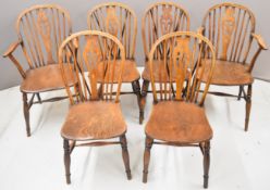 Set of six (2+4) elm seated wheel back dining chairs