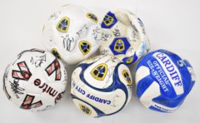 Cardiff City F.C. group of four replica footballs each with multiple signatures and another multi-