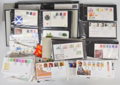 A large quantity of GB first day covers in seven folders and loose, together with three spare