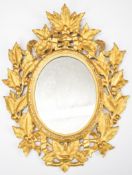 19th century gilt wood oval mirror with pierced and carved foliate decoration, overall height 46cm