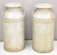 Two aluminium milk churns, one named Express Dairy to side and Northern Dairies to lid, the other