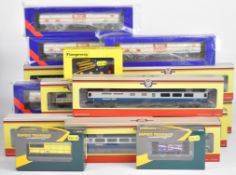 Eighteen 00 gauge model railway passenger carriages and goods wagons, manufacturers to include