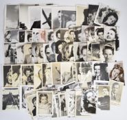 Approximately one hundred black and white photographs of famous personalities, some autographed,