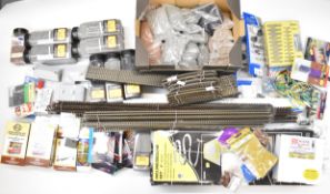 A collection of model railway track, ballast, scatter, tools and accessories, many items in original