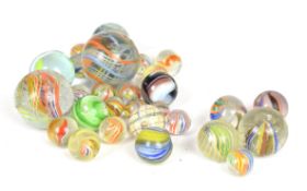 Twenty eight vintage 19th century marbles including onion skin, ribbon core, swirl etc, largest