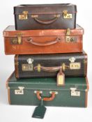 Four vintage leather cases including 'British Racing Green', largest 50 x 31cm