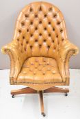 Chesterfield brown leather swivel office or desk chair, raised on castors