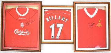 Liverpool F.C. a group of three signed replica football shirts autographed by Steven Gerrard,