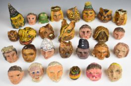 Twenty-eight handmade papier maché Kasperle or Punch & Judy puppet heads dating to the early