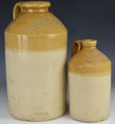 Two stoneware flagons comprising Glanville and Co, Basingstoke and C.H. Hughes, Henley in Arden,