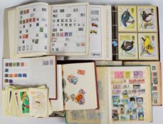 Assorted stamp collection in various albums and folders, including PHQ cards and world stamps