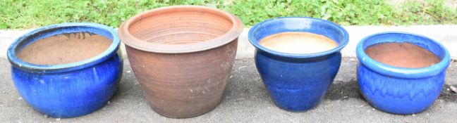 Graduated group of three blue jardinières / garden planters together with a bronzed terracotta