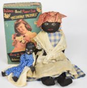 Two children's ethnic dolls comprising a Palitoy 'Piccaninny Pigtails' puppet doll in original box