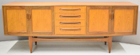 G Plan mid century modern sideboard, having four drawers flanked by double cupboards to each end,