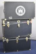 Three 'United States Coast Guard' branded contemporary metal bound steamer trunks with twin