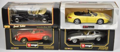 Four 1:18 scale diecast model sports cars by Maisto, Bburago and UT Models comprising Porsche 996