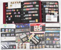 Collection of world stamps in two albums and GB presentation packs and loose GB mint world stamps