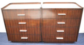 Pair of Ralph Lauren Art Deco inspired Metropolis design chests of four drawers with gallery tops