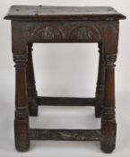 17th/18thC carved oak peg jointed stool, height 54cm