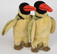 Two vintage Steiff 'Peggy' penguins, both with swivel heads, nubuck feet and button under wing,