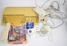 Commodore Amiga A500 home computer with power supply, additional RAM, mouse, leads etc.