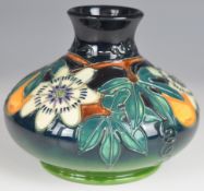 Moorcroft squat pedestal vase decorated in the Passion Fruit pattern, dated 97 to base, H12cm