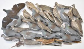 A large collection of mainly pigeon shooting decoys, some with flapping wings.