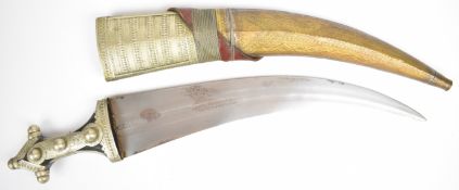 Saudi Arabian Wahhabite jambiya dagger with embossed and studded white metal decoration, wooden