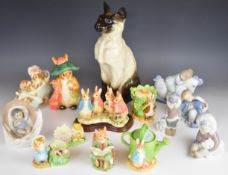 Collection of Lladro, Nao Border Fine Arts figurines and a Beswick Fireside cat, tallest 35cm