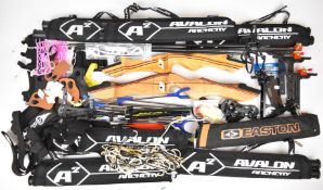 A collection of archery equipment including five sets of sights, two laminated wooden risers, Avalon
