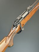 Remington 700 .308 bolt-action rifle with chequered semi-pistol grip and forend, raised cheek piece,