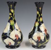 Pair of Moorcroft signed Philip Gibson limited edition 154 and 63/350 pedestal vases decorated in