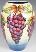 Moorcroft Pottery vase decorated in the Grapevine / Red Grapes pattern, H18cm