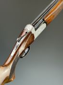 Sportarmi 12 bore over and under shotgun with engraved locks, underside, top plate and thumb