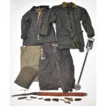 A collection of gun and shooting related items comprising a shooting stick, shotgun cartridge