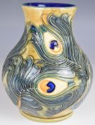 Moorcroft pedestal vase decorated with feathers in the Phoenix pattern, dated 99 to base, H16cm