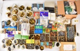 A very large collection of re-loading materials including empty brass cases, bullet heads, less