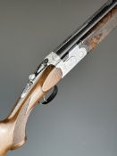 Beretta 687DL Deluxe Sporting 12 bore over and under ejector shotgun with engraved scenes of birds