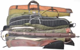 Twelve various shotgun or rifle slips including two BSA examples, together with a padded pistol or