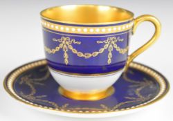 Royal Worcester demitasse cabinet cup and saucer with gilded and jewelled decoration and gilt wash