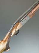 ATA Supersport 12 bore over and under ejector shotgun with chequered semi-pistol grip and forend,