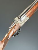 Merkel 12 bore over and under ejector shotgun with heavily carved action featuring scenes of